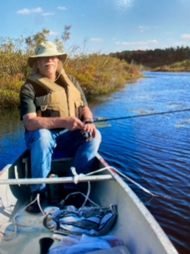 Hilton Everett Moore, who writes the North of Nelson stories published by Silver Mountain Press, fishing from a canoe in the Upper Peninsula of Michigan.